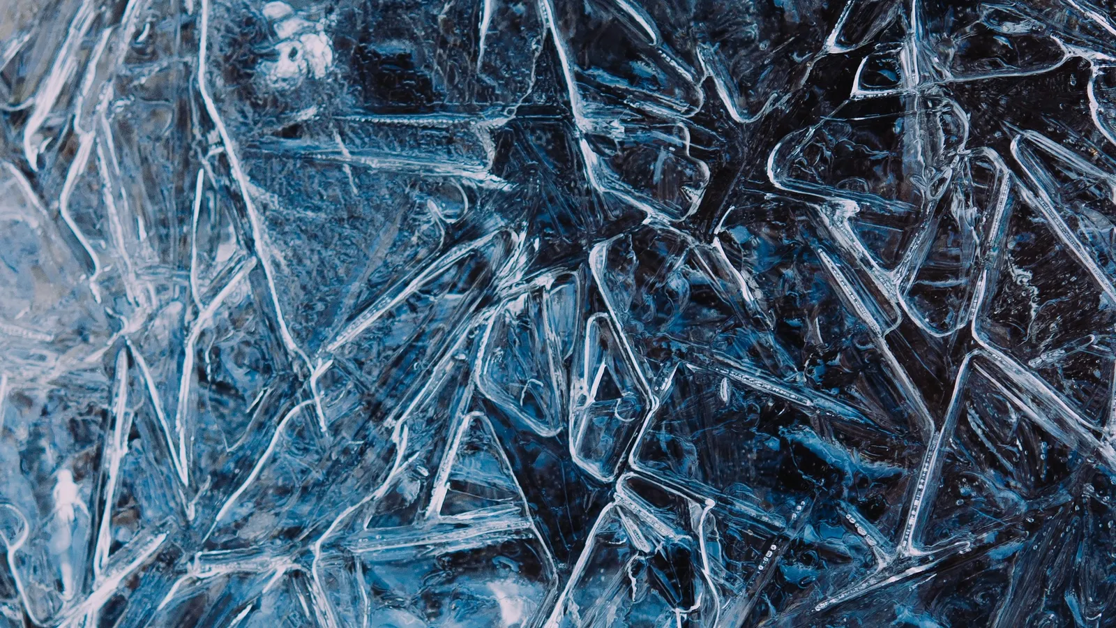 Clear needle-like crystals packed together