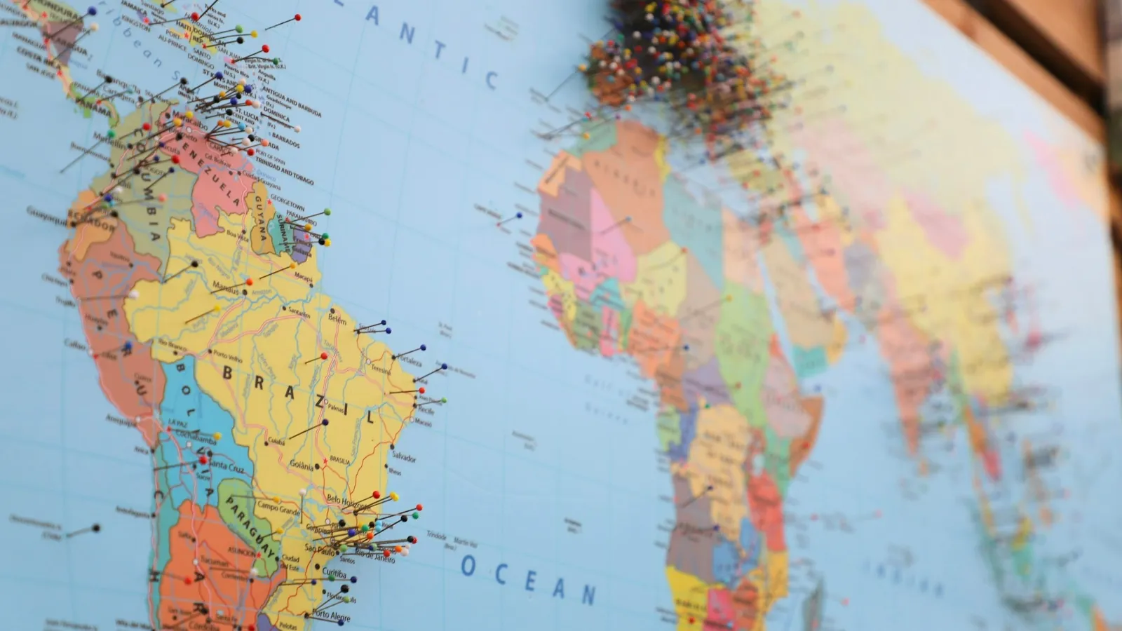 Close-up of continents on a colourful printed map