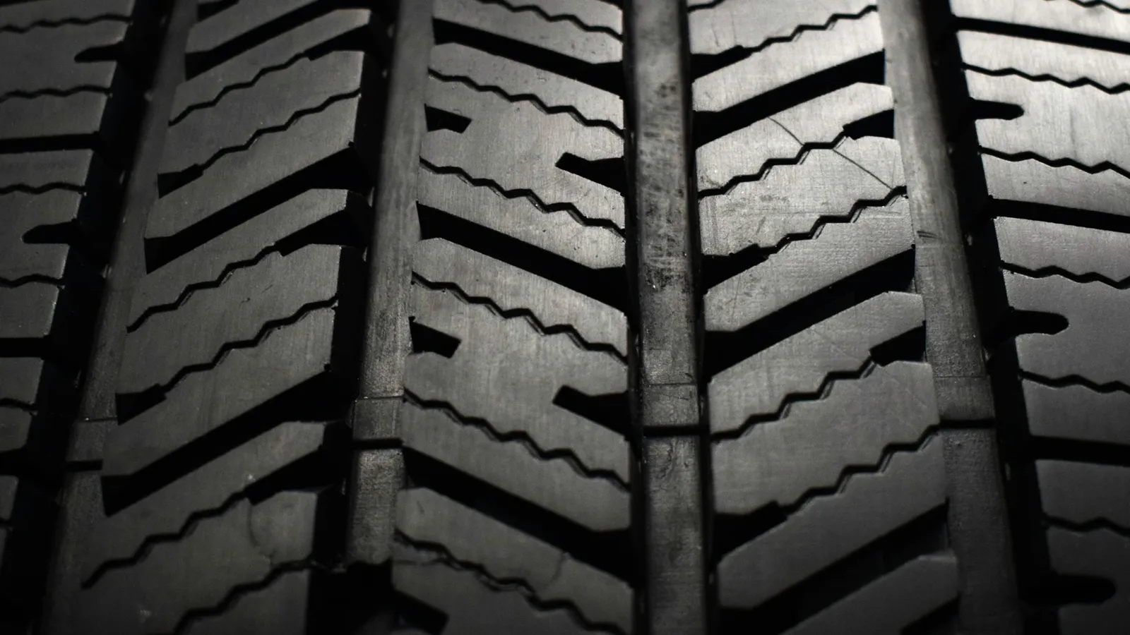 Close-up of the deep tread on a black tyre