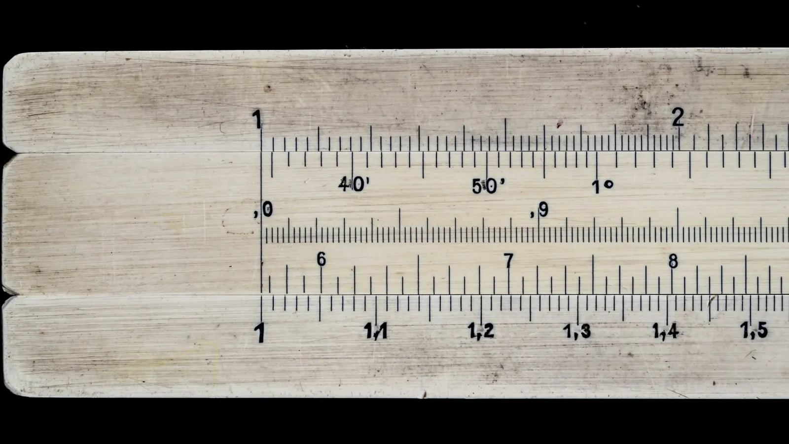 Close-up of the scales on a wooden slide rule