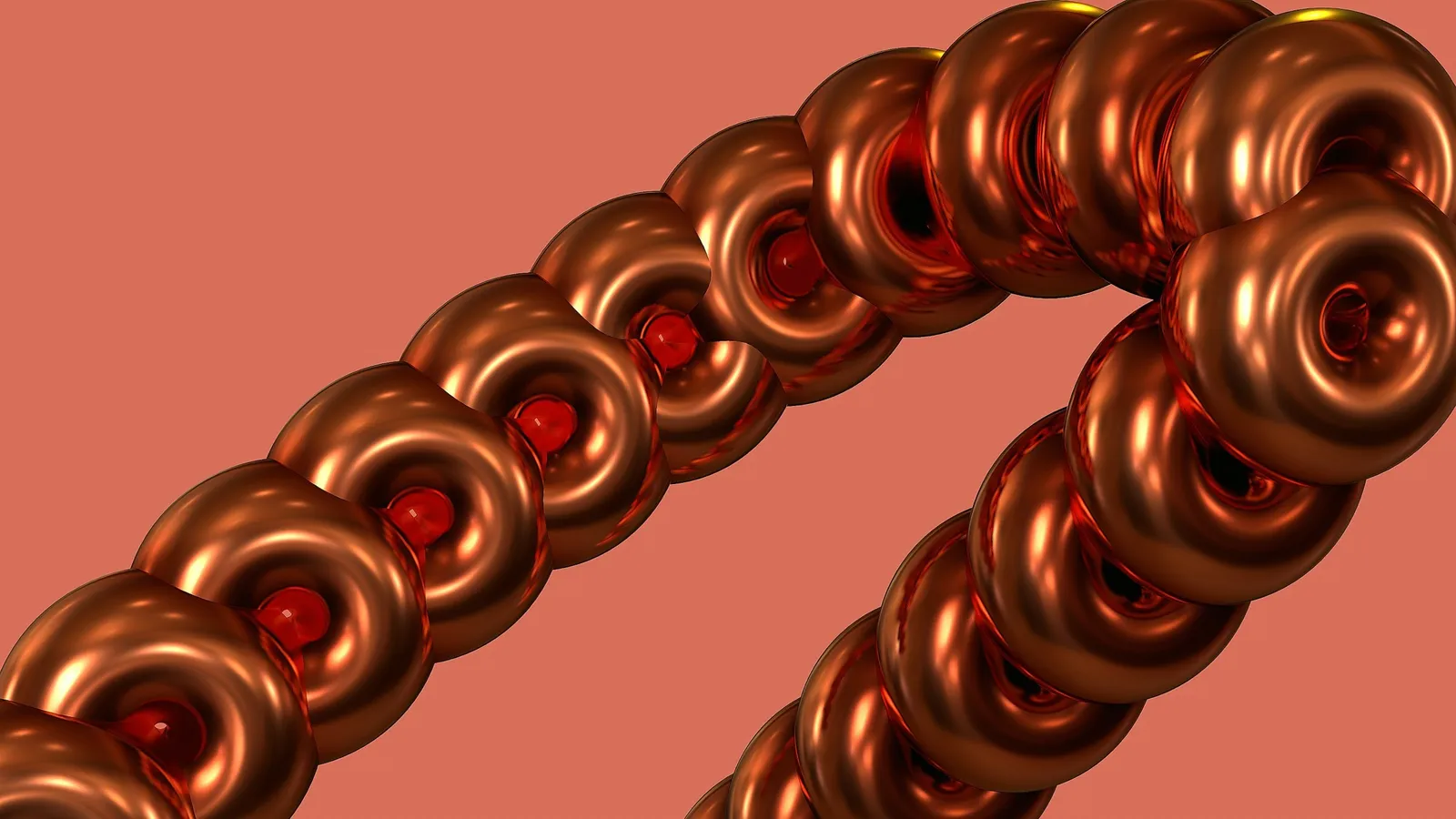 Coiled copper looped into rings against a coral background