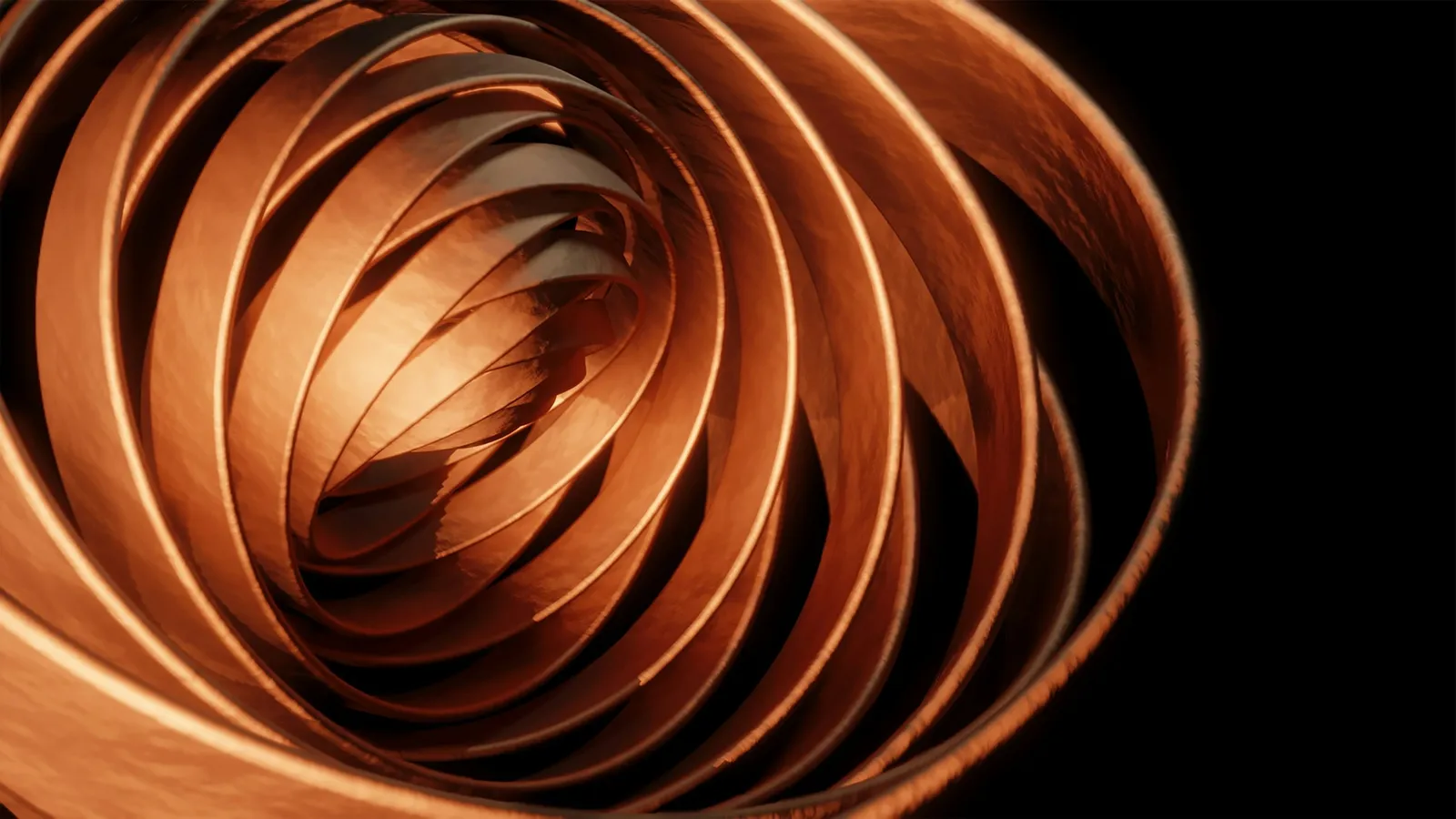 Coils of copper wire curving in the light
