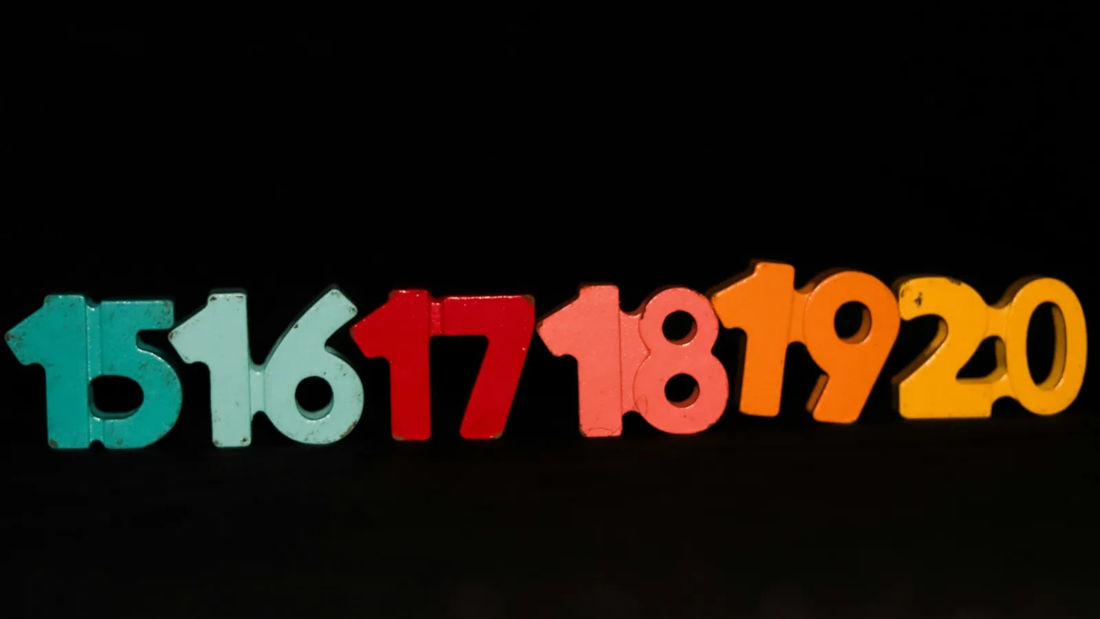 Coloured felt numbers 15 to 20 in a row