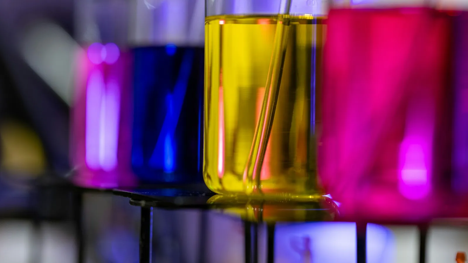 Coloured liquids in glass beakers
