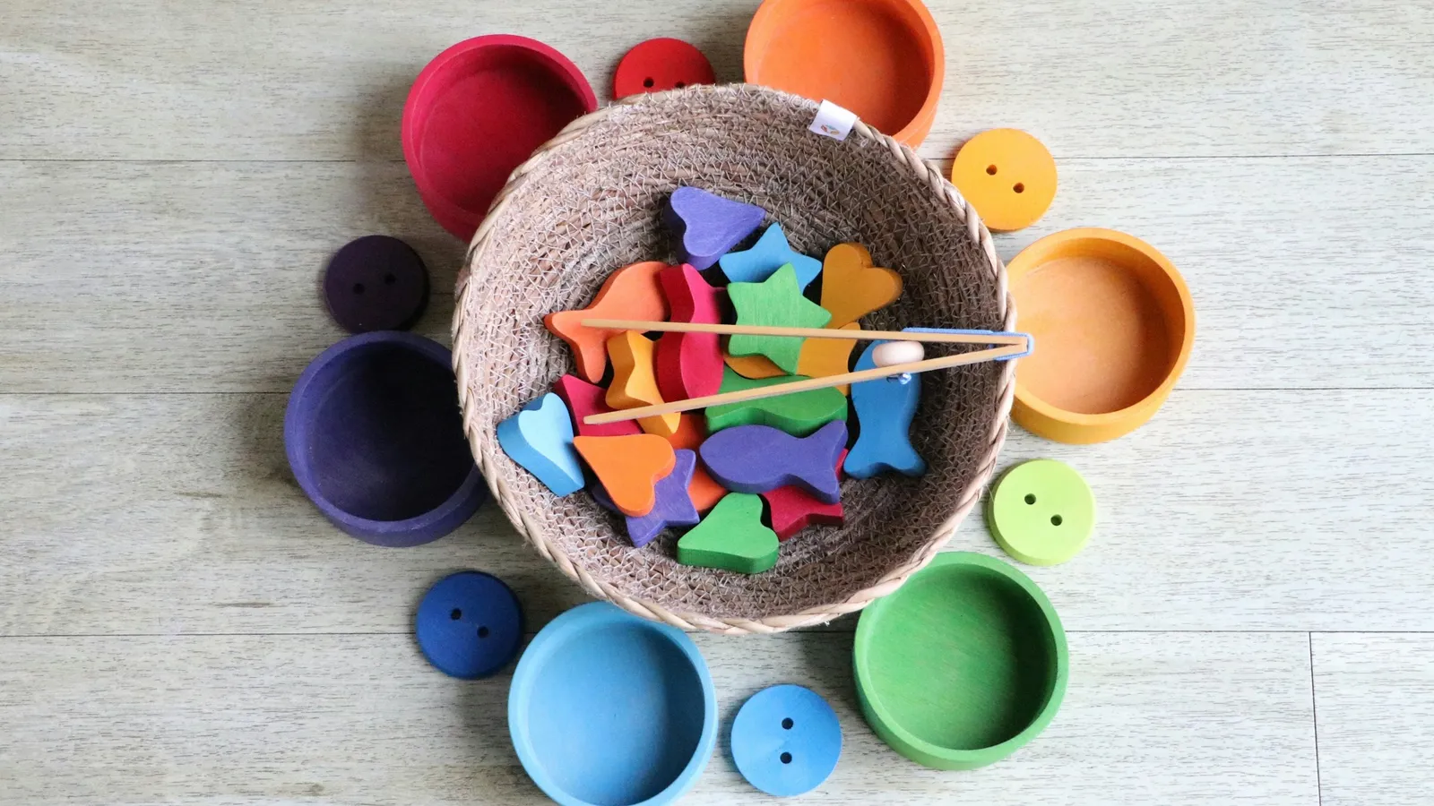Coloured shapes sorted into matching bowls