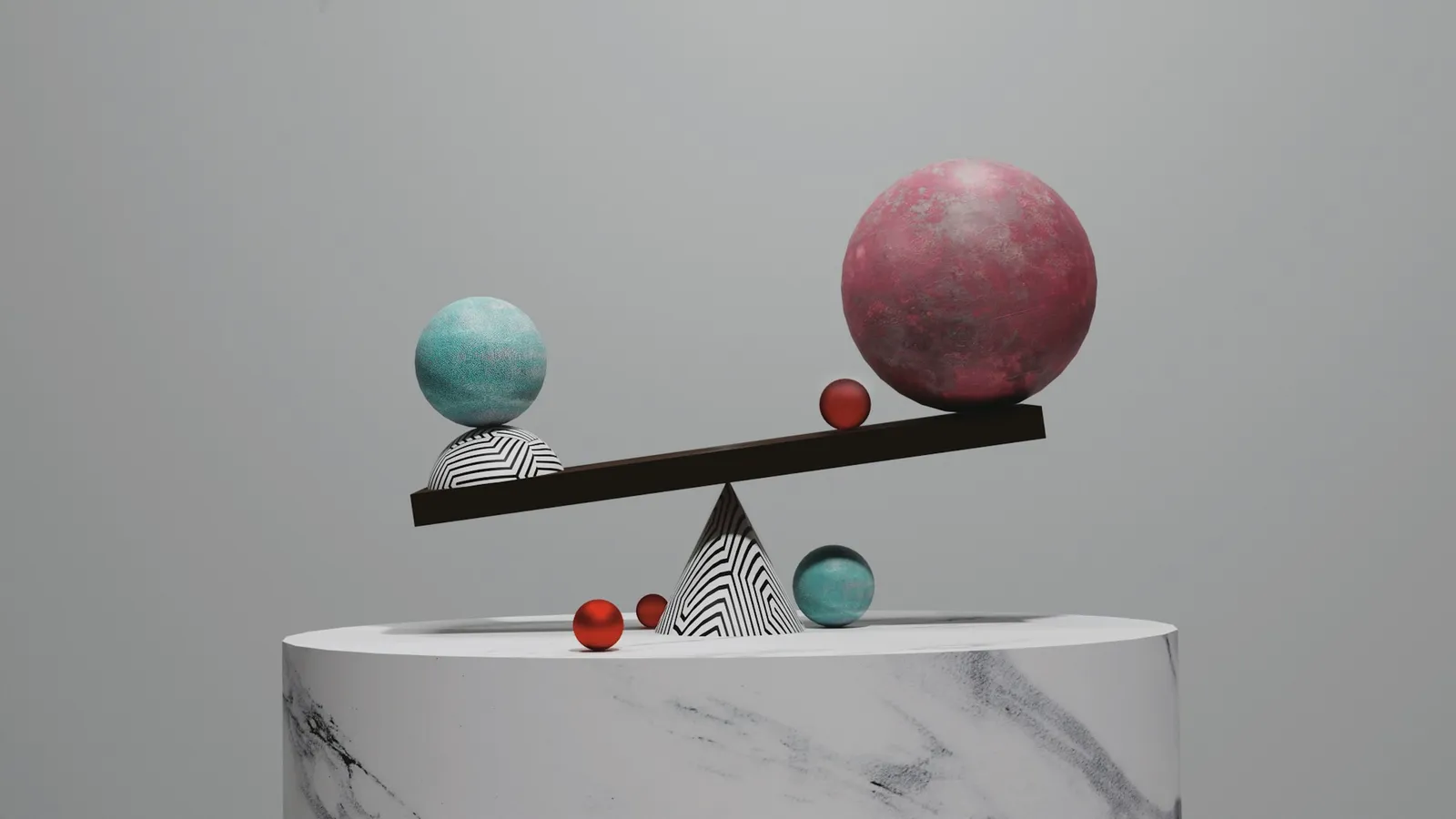 Coloured spheres balanced on a tilted board