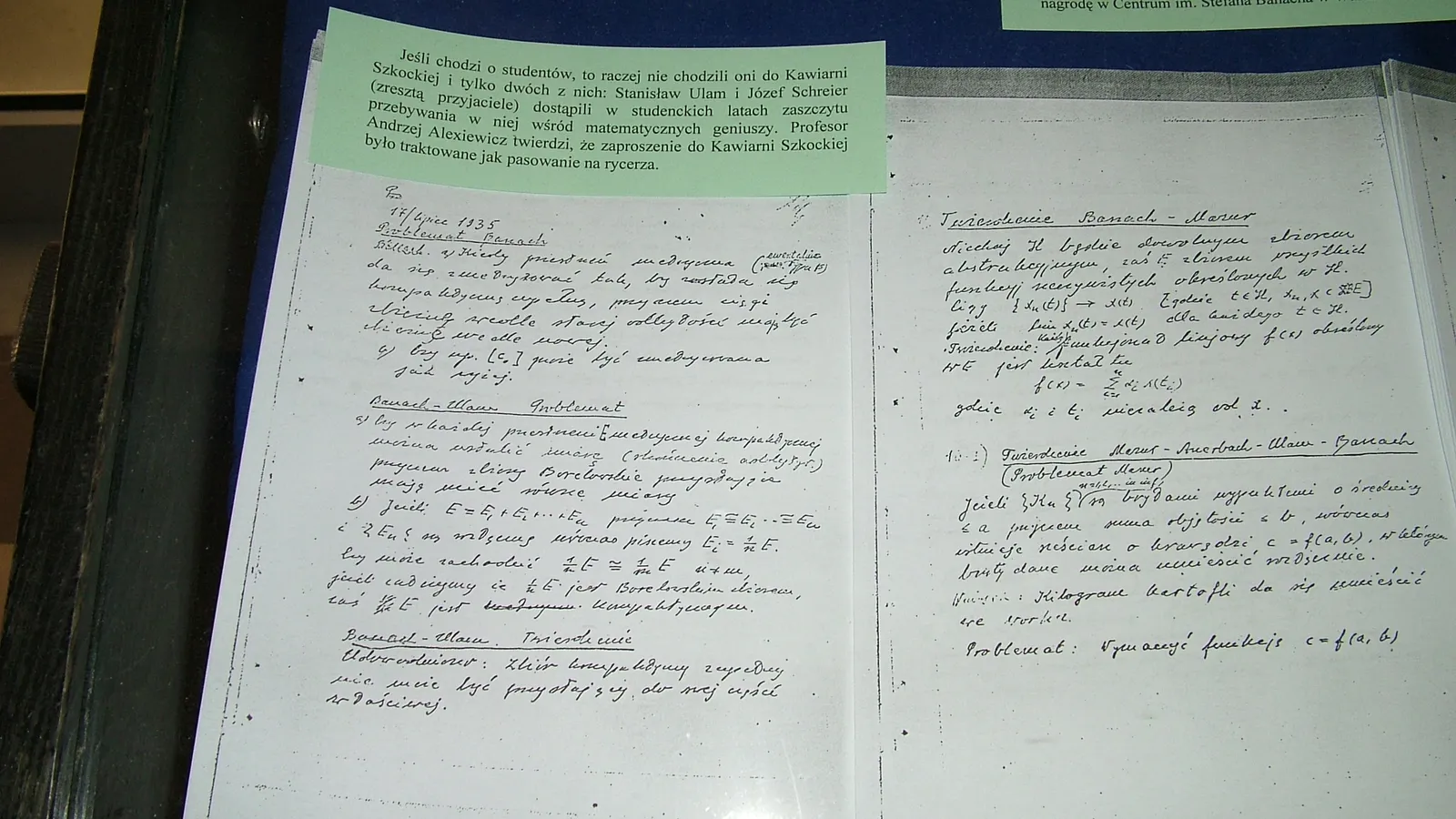 Copies of the Scottish Book's first handwritten pages in a museum display case