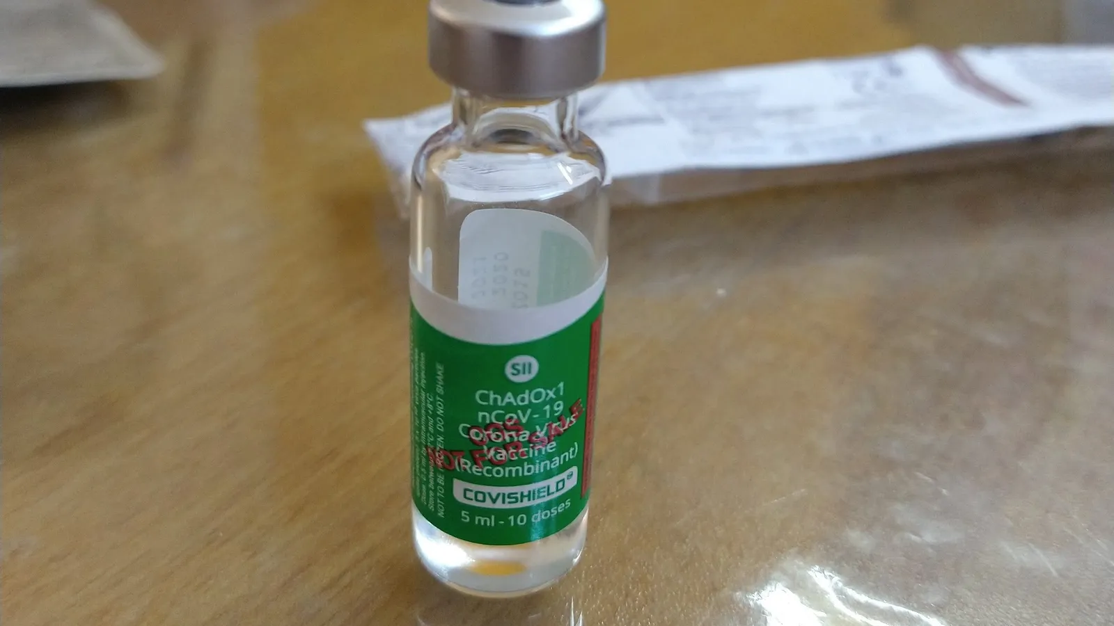 Covishield vial labelled ChAdOx1 nCoV-19 corona virus vaccine on a table