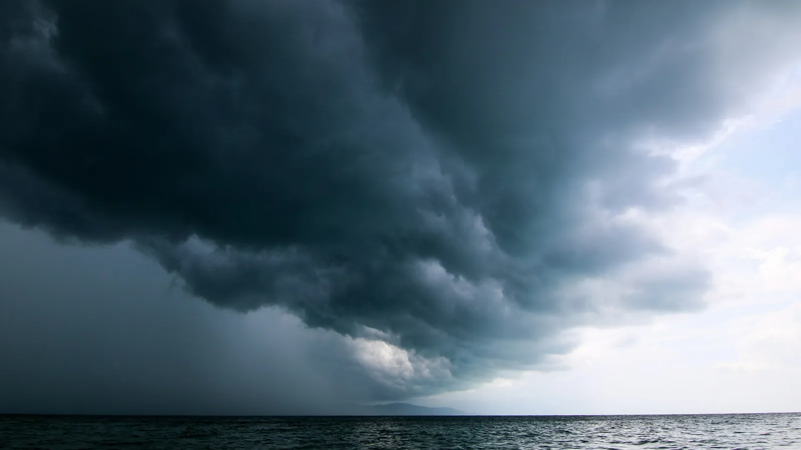 Dark storm clouds gathering over the sea