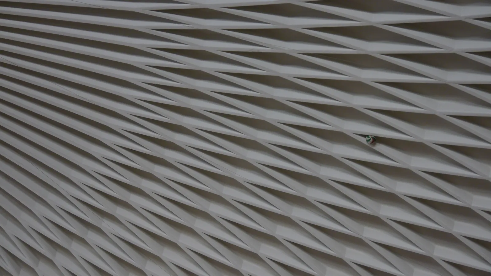Diamond-patterned concrete ribs under the Palazzetto dello Sport dome in Rome