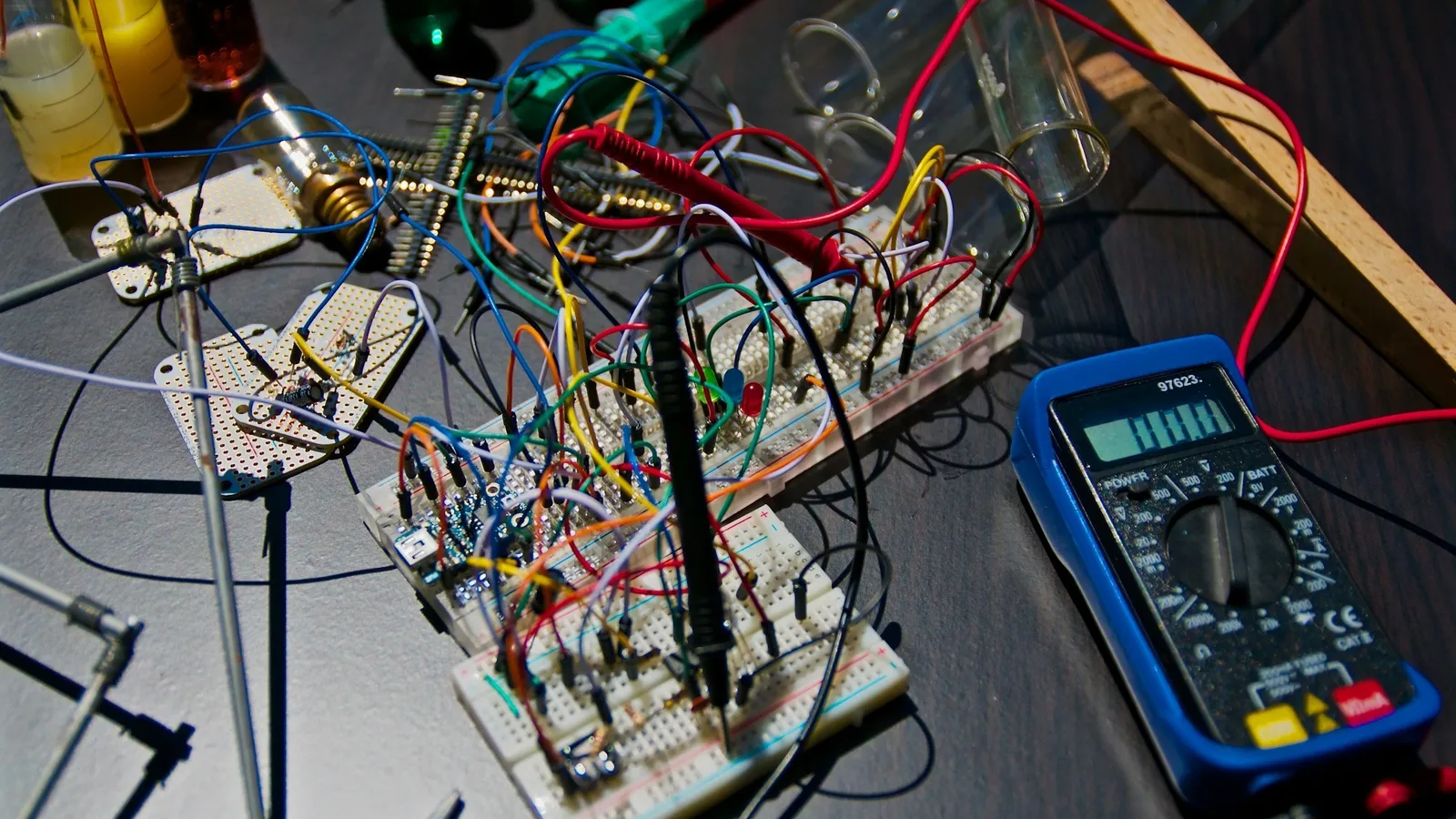 Electronic circuit on a breadboard with a multimeter