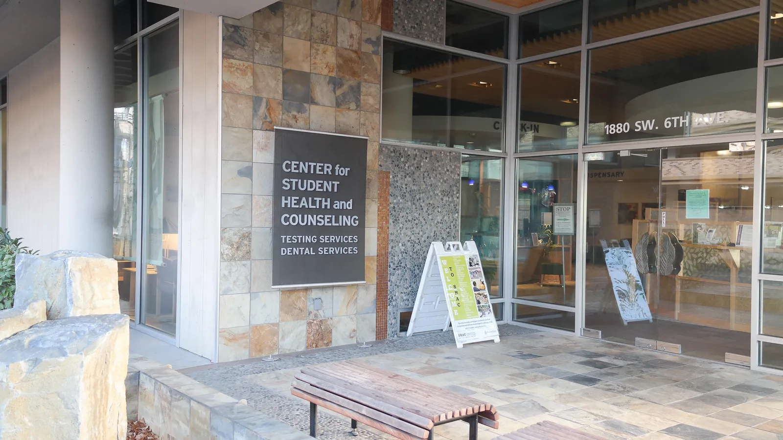 Entrance to a university student health and counselling centre with benches outside