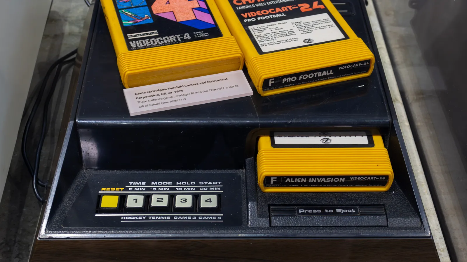 Fairchild Channel F console from 1976 with three yellow game cartridges