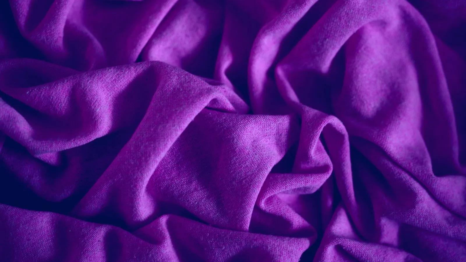 Folds of deep purple fabric