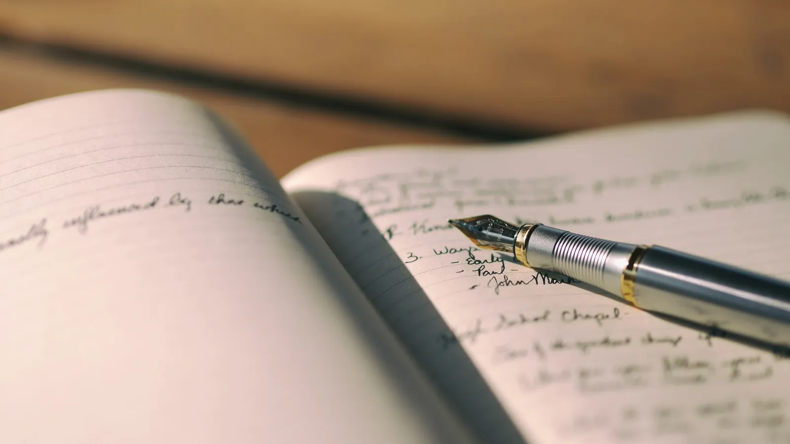 Fountain pen writing in an open notebook