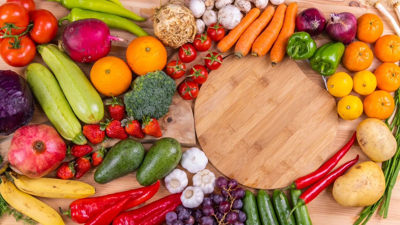 Fresh fruits and vegetables arranged in a circle