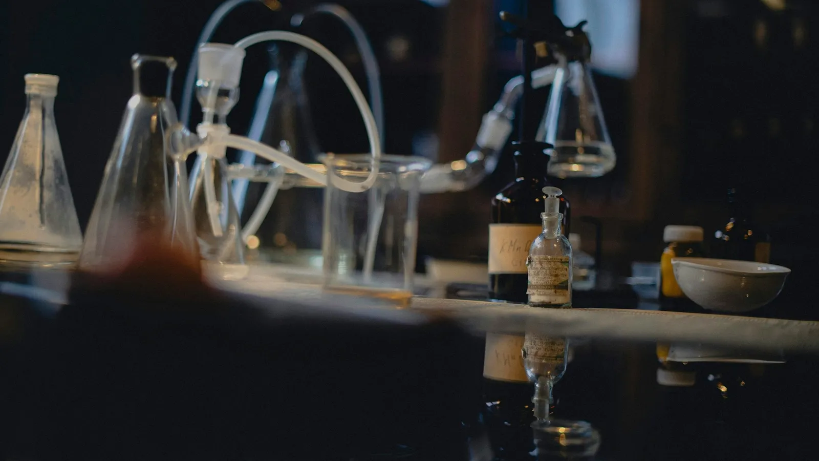 Glass flasks and tubing on an old laboratory bench
