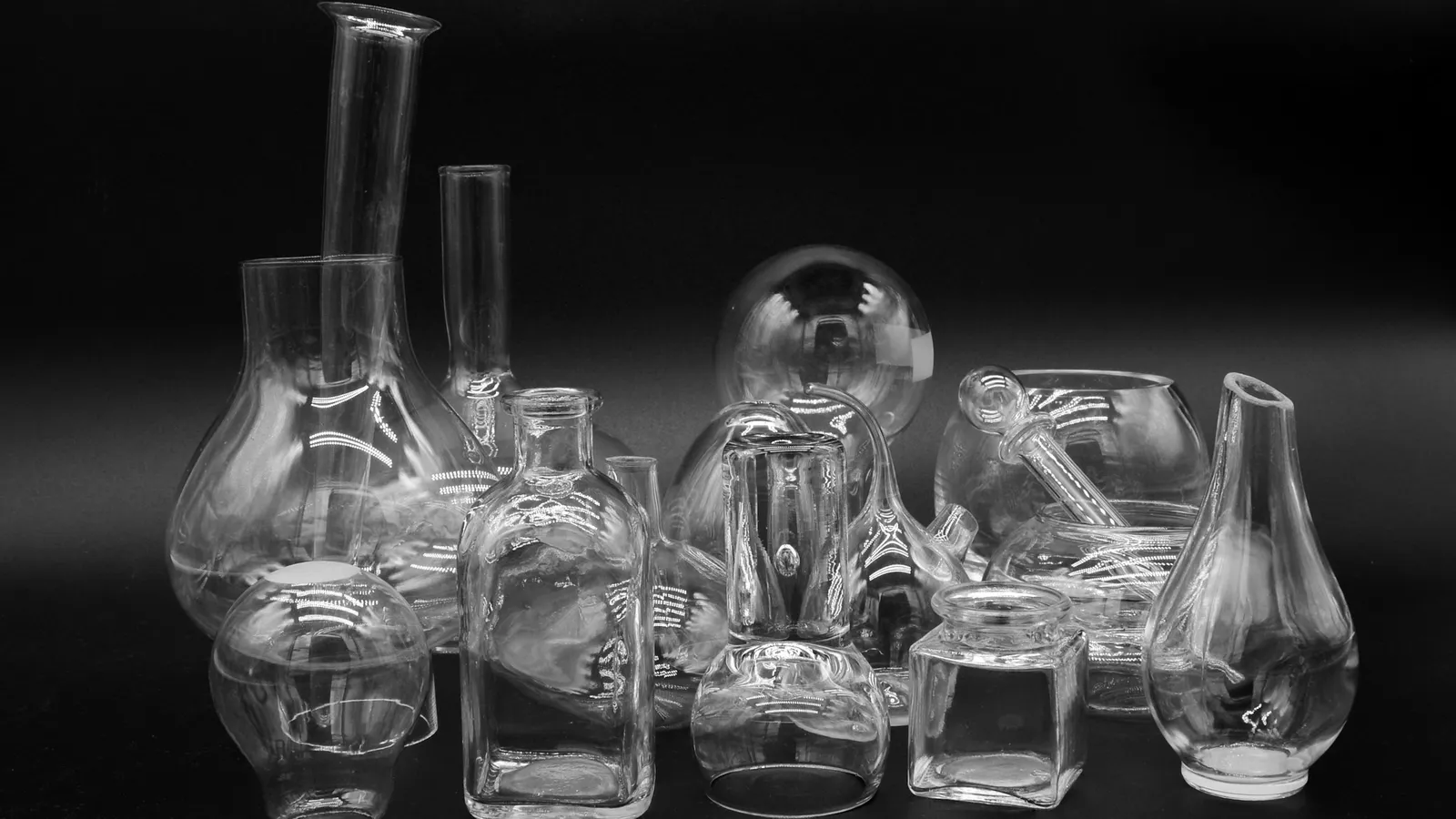 Glass laboratory flasks in black and white