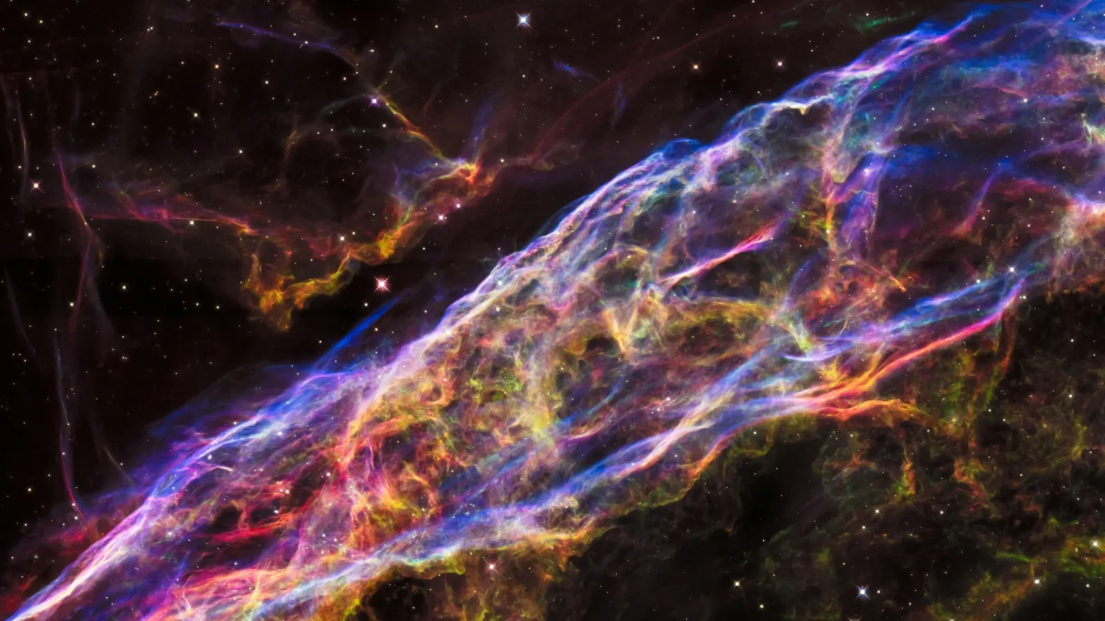 Glowing filaments of a supernova remnant in space