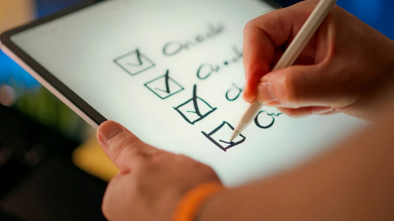 Hand ticking boxes on a checklist