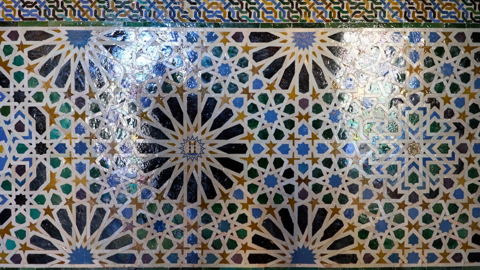 Intricate star-patterned tiles on a wall