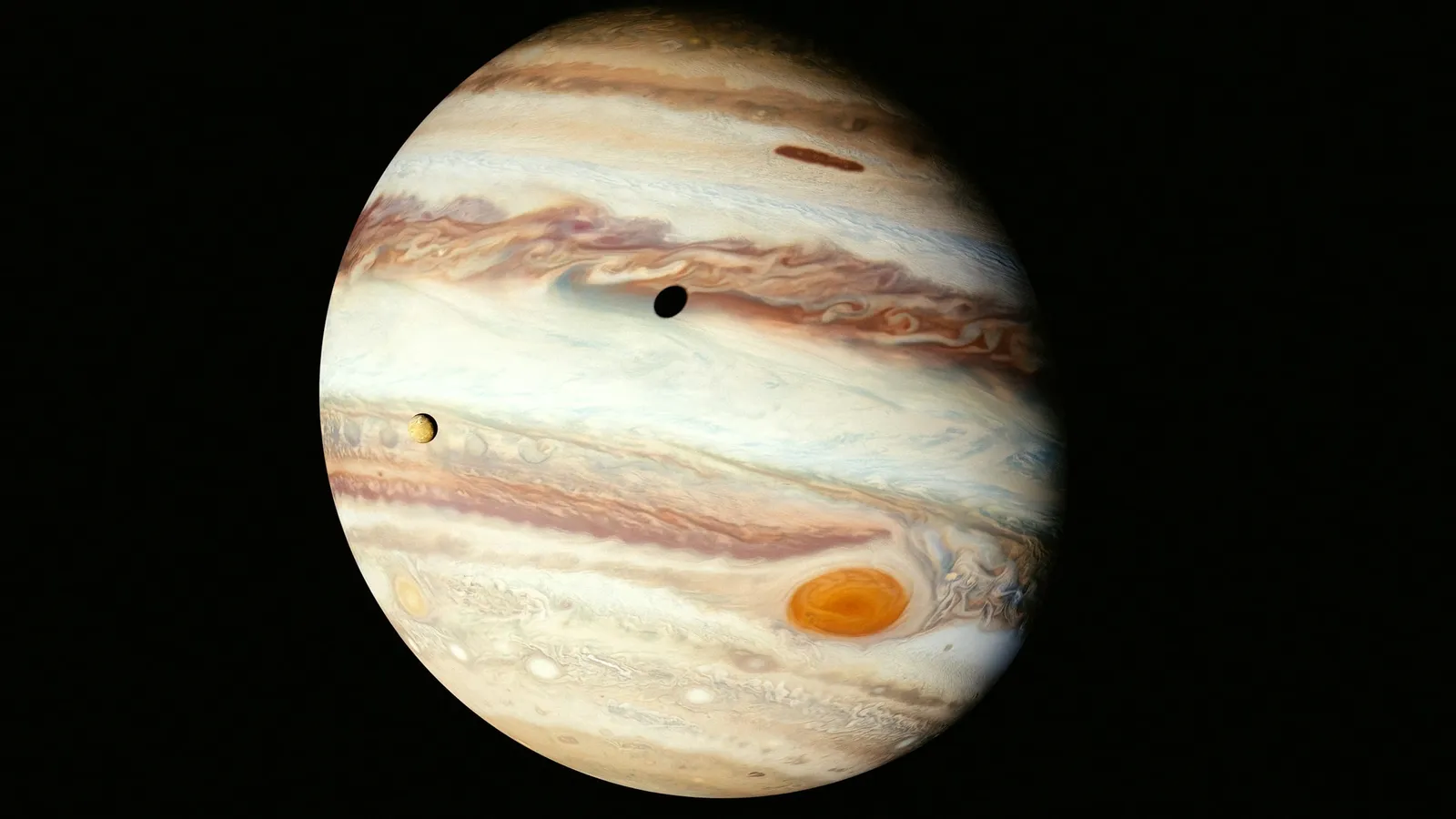 Jupiter with a moon casting a shadow on its banded clouds