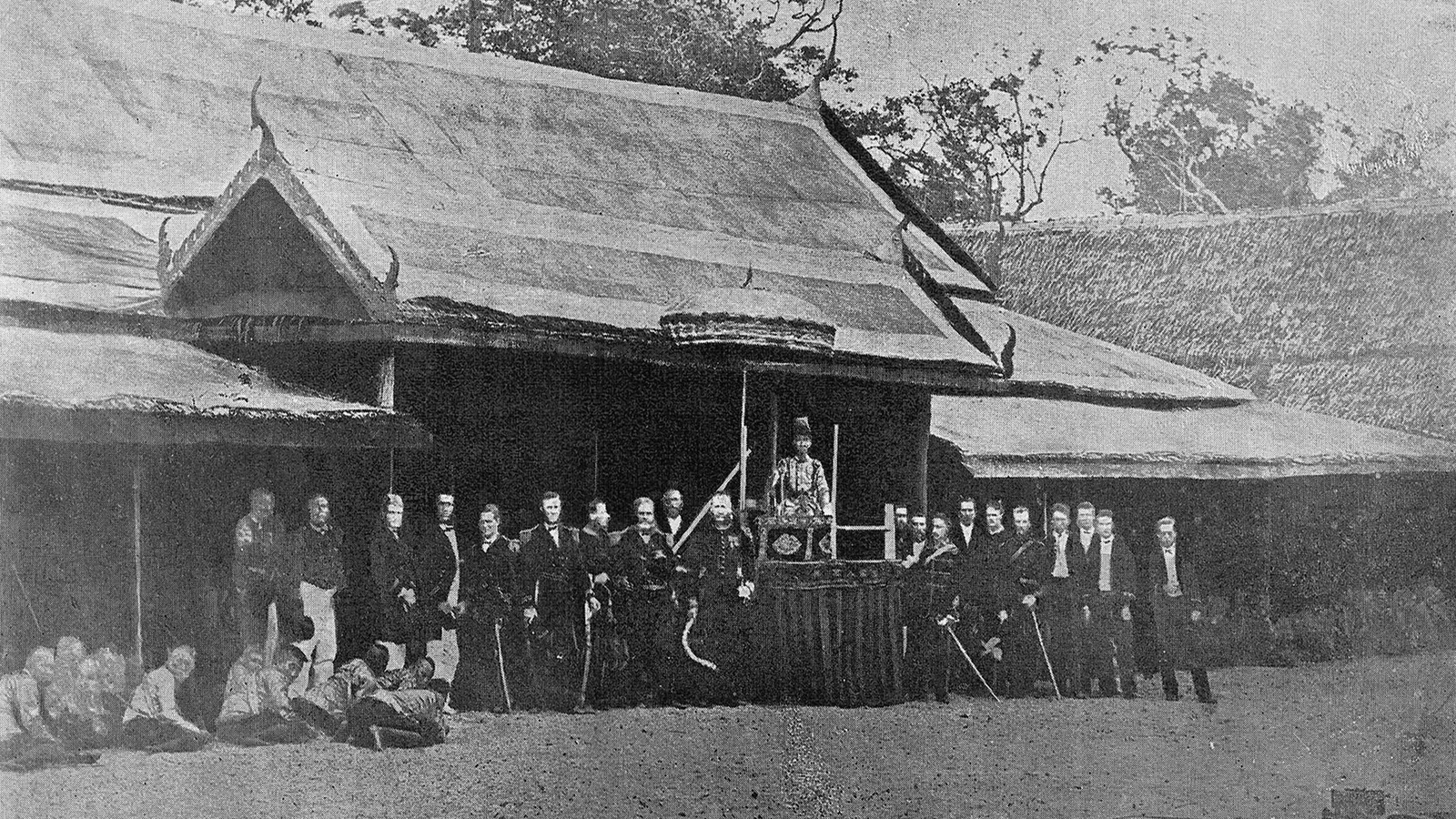 King Mongkut on a raised dais at his Wa Ko pavilion in 1868, flanked by European officers