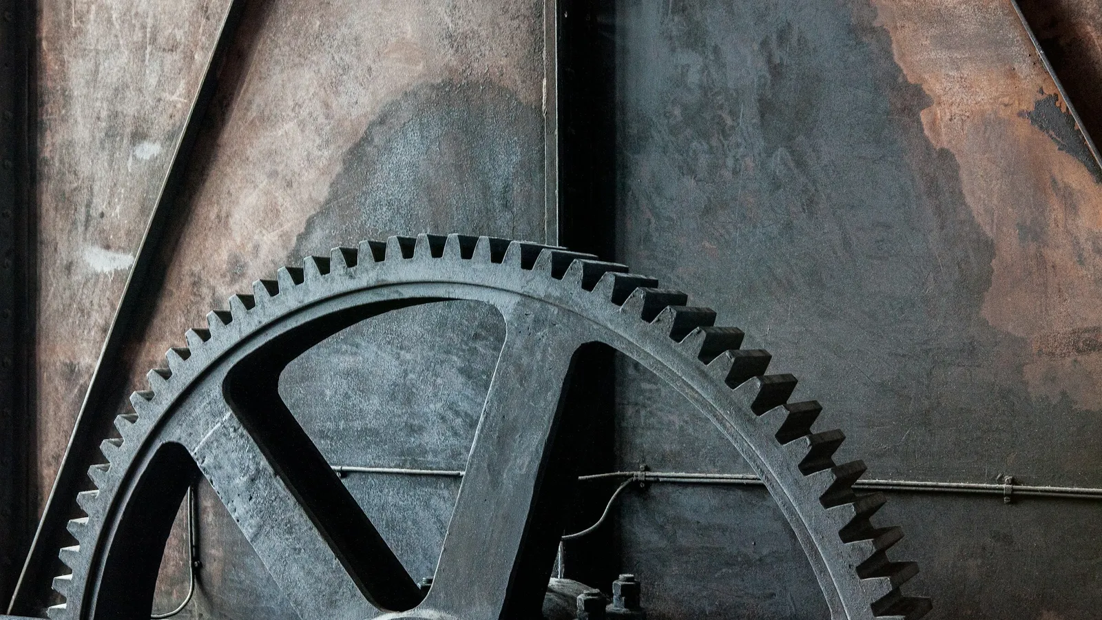 Large old iron gear wheels meshing together