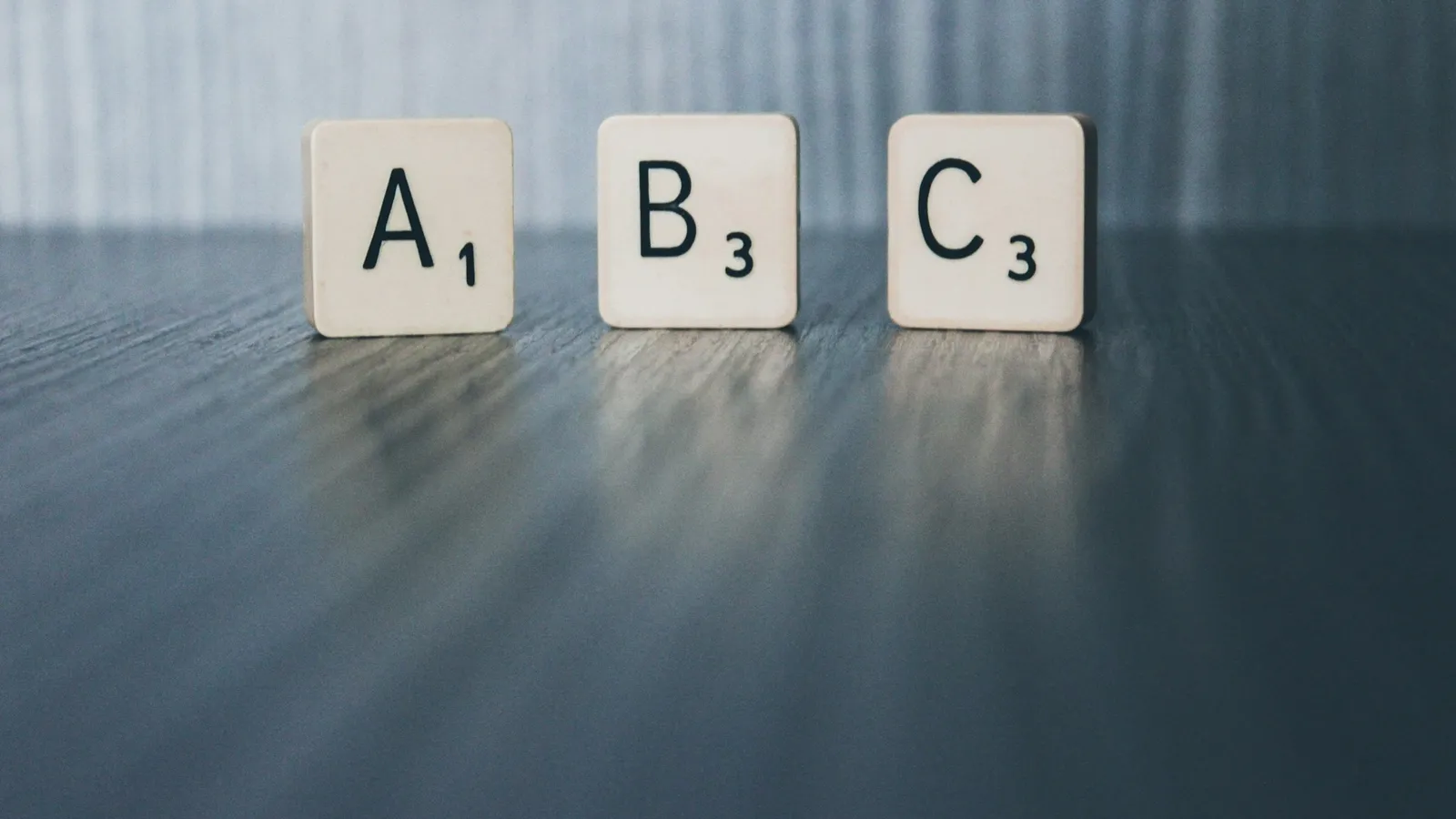 Letter tiles reading A, B and C on a table