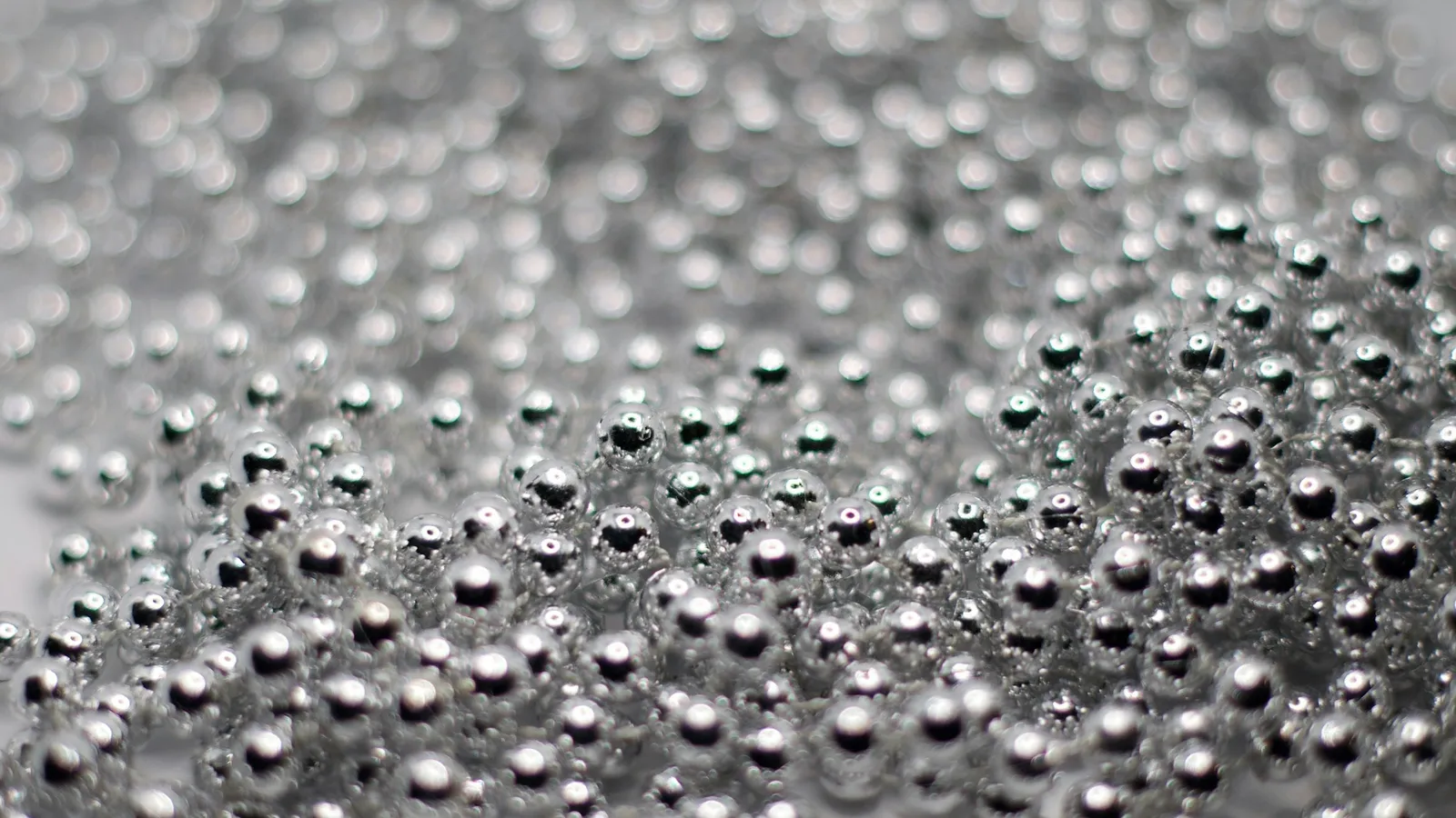Many tiny silver beads, close up
