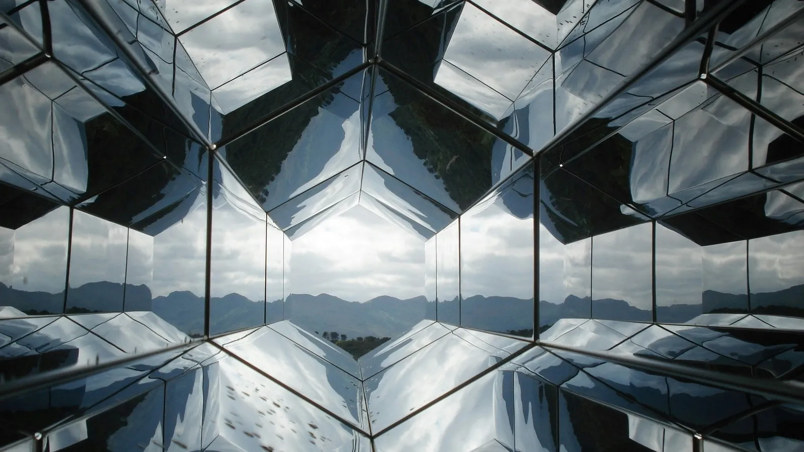 Mirrors reflecting a pattern into an endless tunnel