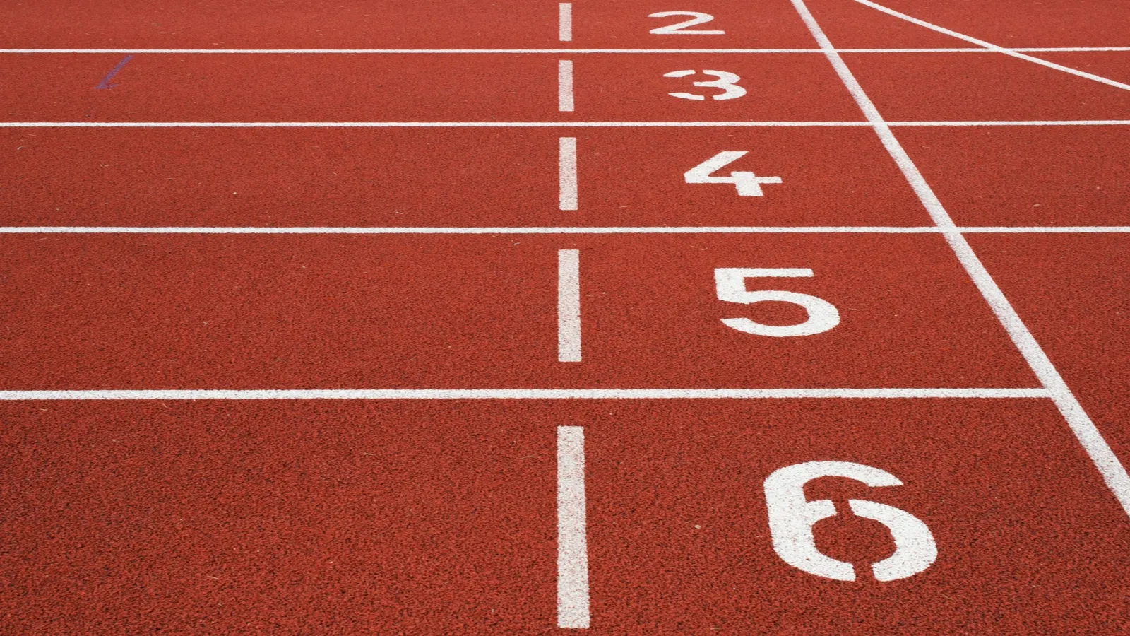 Numbered lanes on a red running track