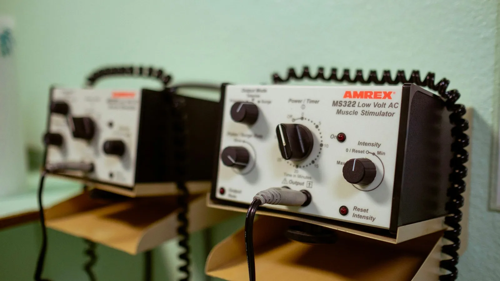Old electrical meters and a power supply on a laboratory bench