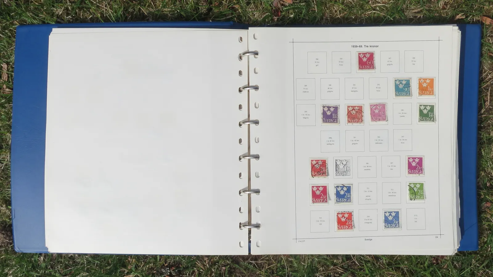 Open blue stamp album with Swedish three-crown stamps in numbered boxes