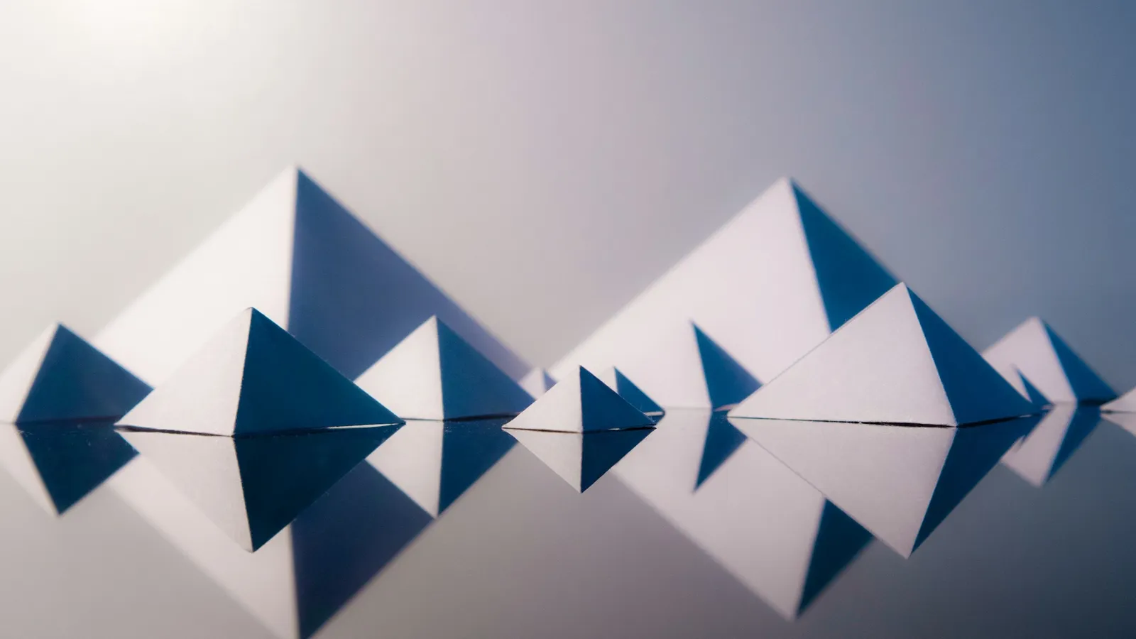 Paper triangles reflected in a line