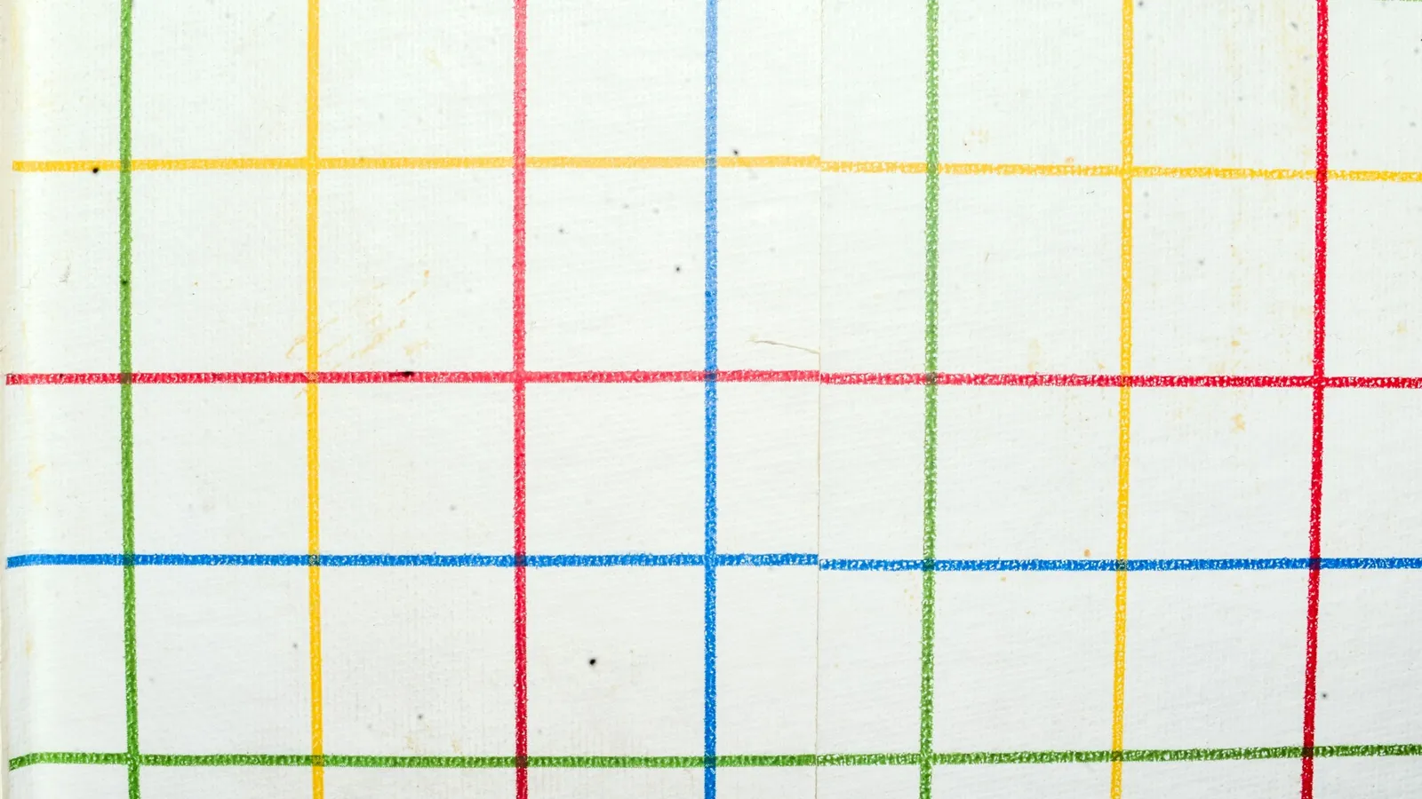 Paper with a grid of coloured lines forming rows and columns