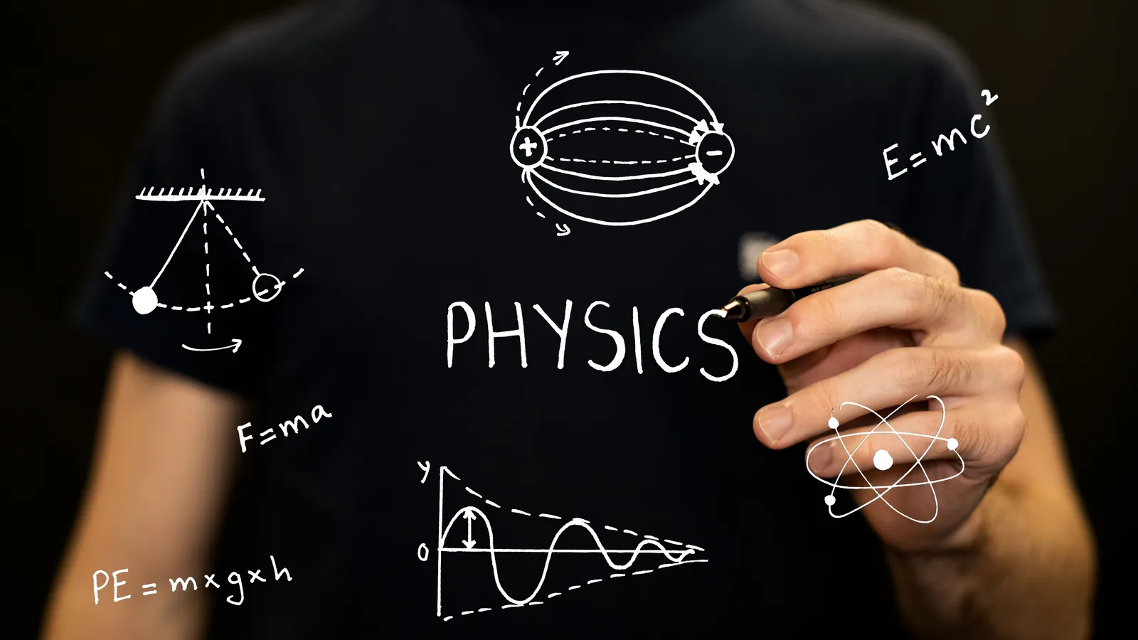 Person writing 'PHYSICS' and physics diagrams and equations on a glass board