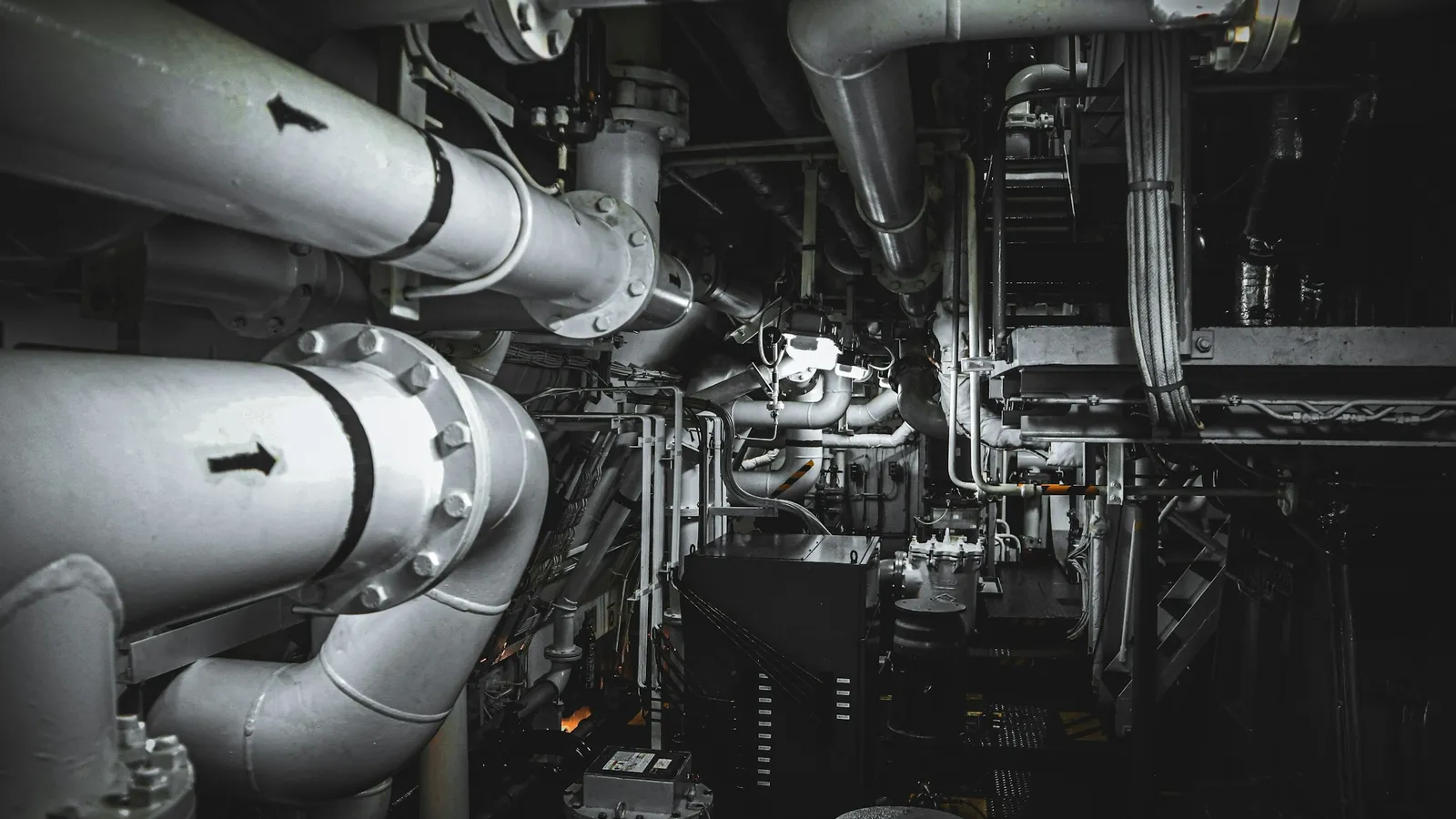 Pipes and machinery in a ship engine room