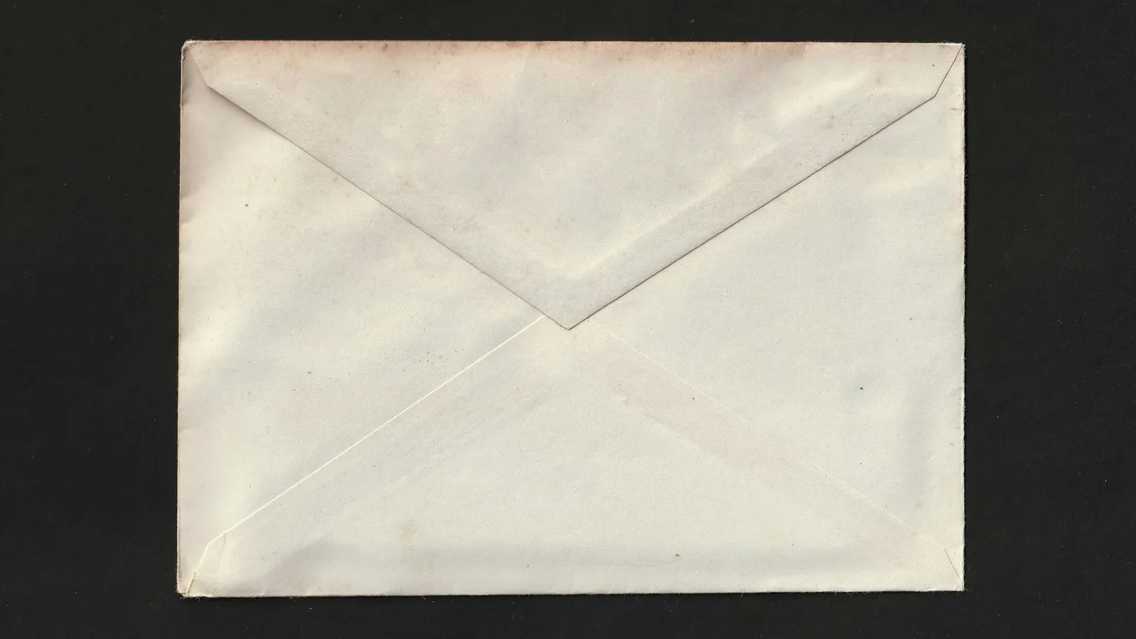 Plain envelope on a dark surface