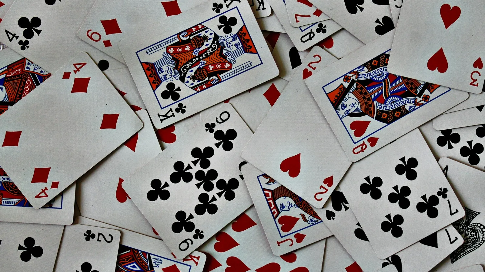 Playing cards scattered across a table