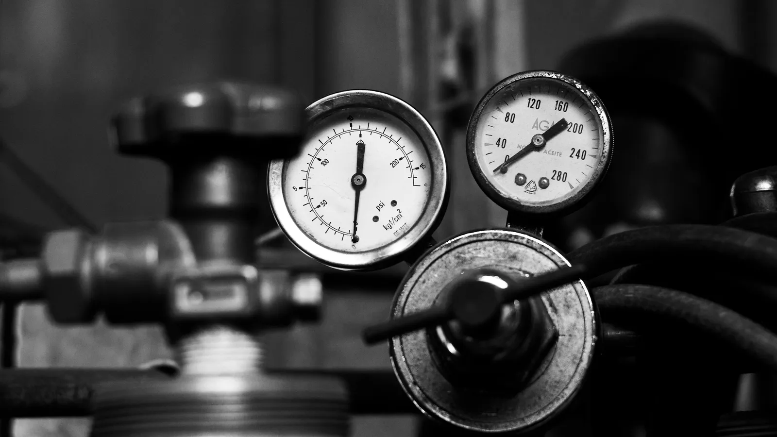 Pressure gauges on gas cylinder valves, in black and white