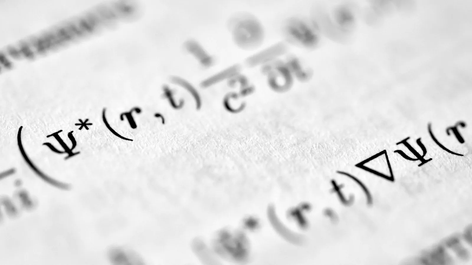 Printed mathematical equations on white paper