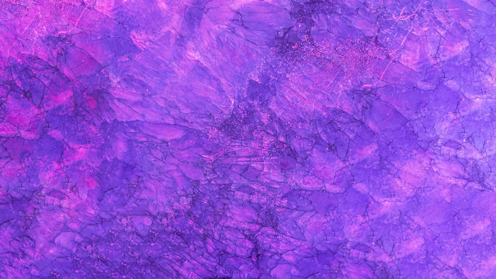 Purple dyed fabric with a mottled texture