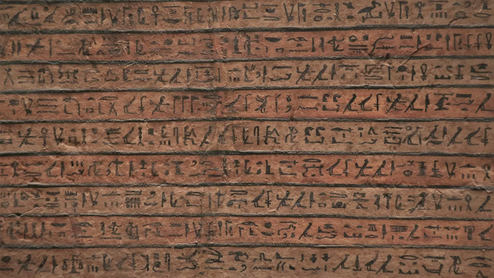 Rows of ancient script carved into stone