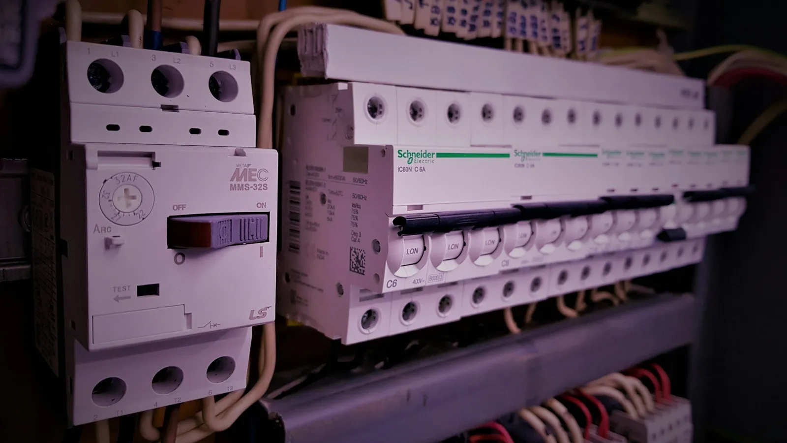 Rows of electrical relays and switches in a cabinet