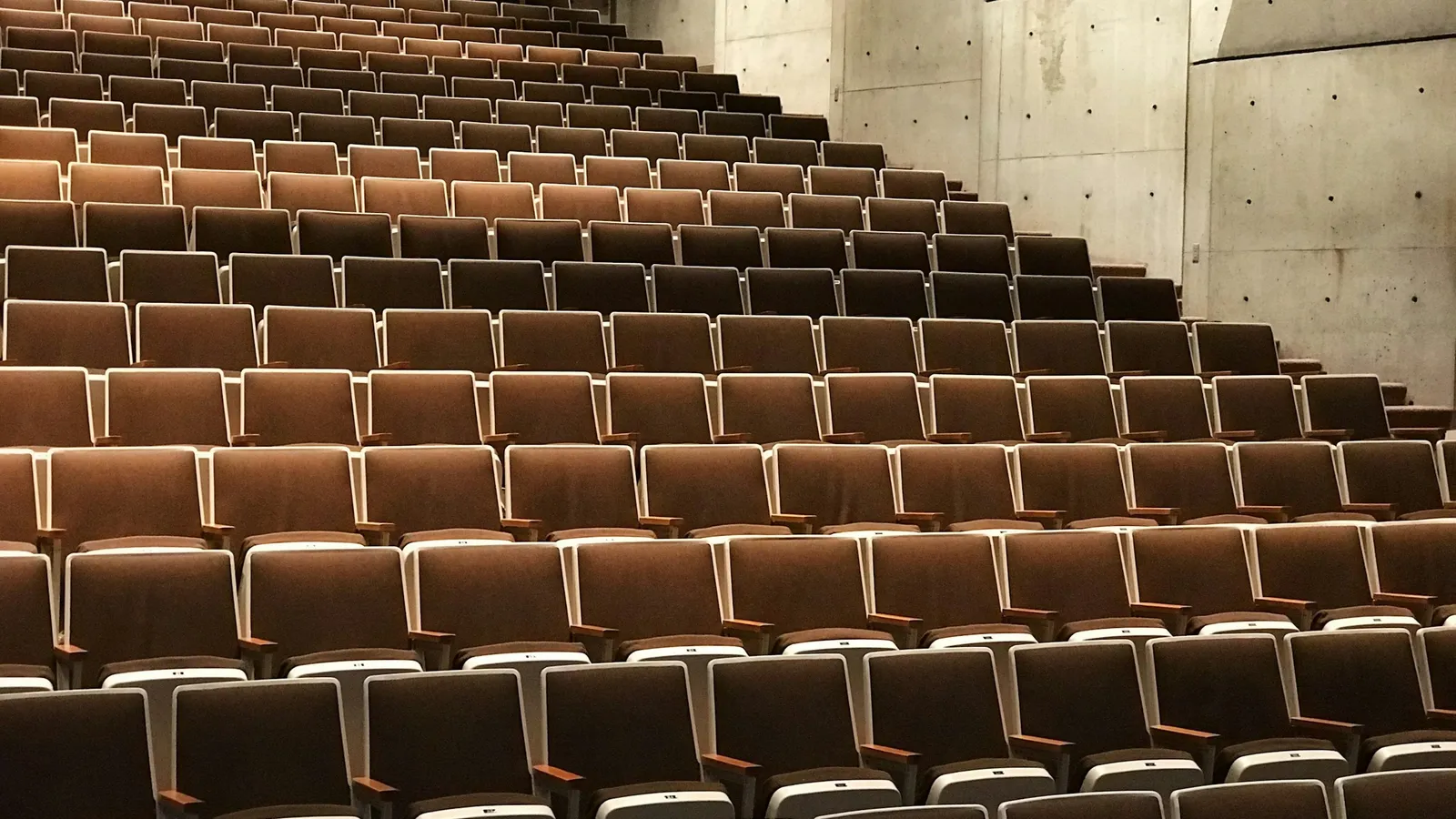 Rows of empty seats in an auditorium