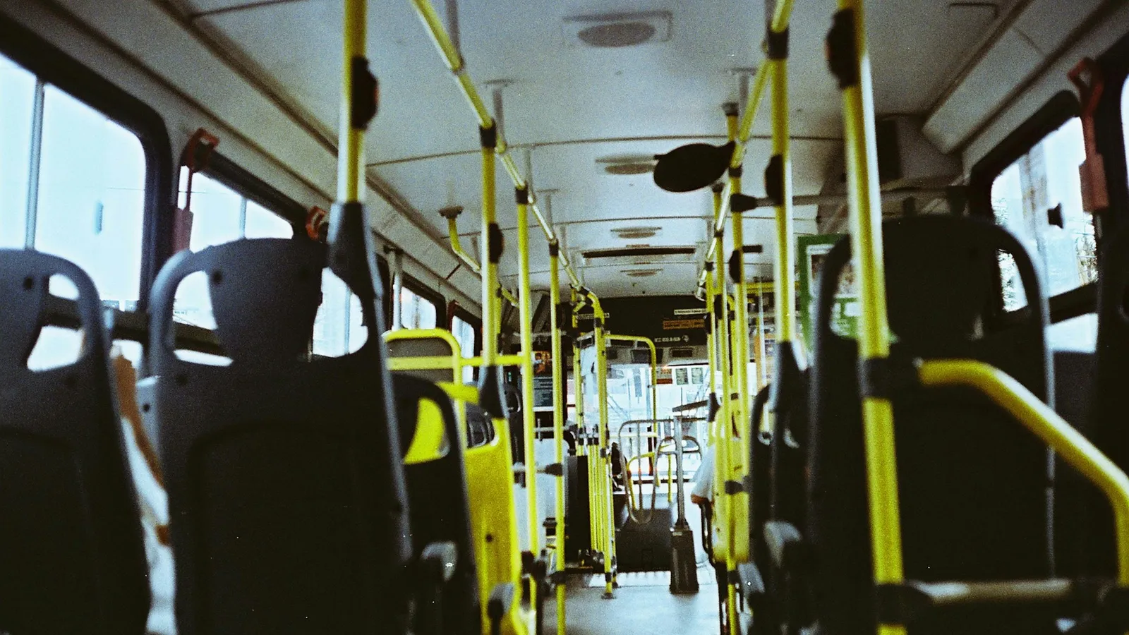 Rows of empty seats inside a bus