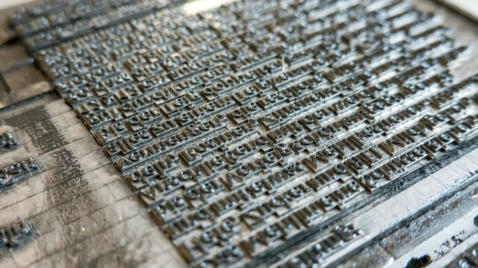 Rows of old metal printing type, close up