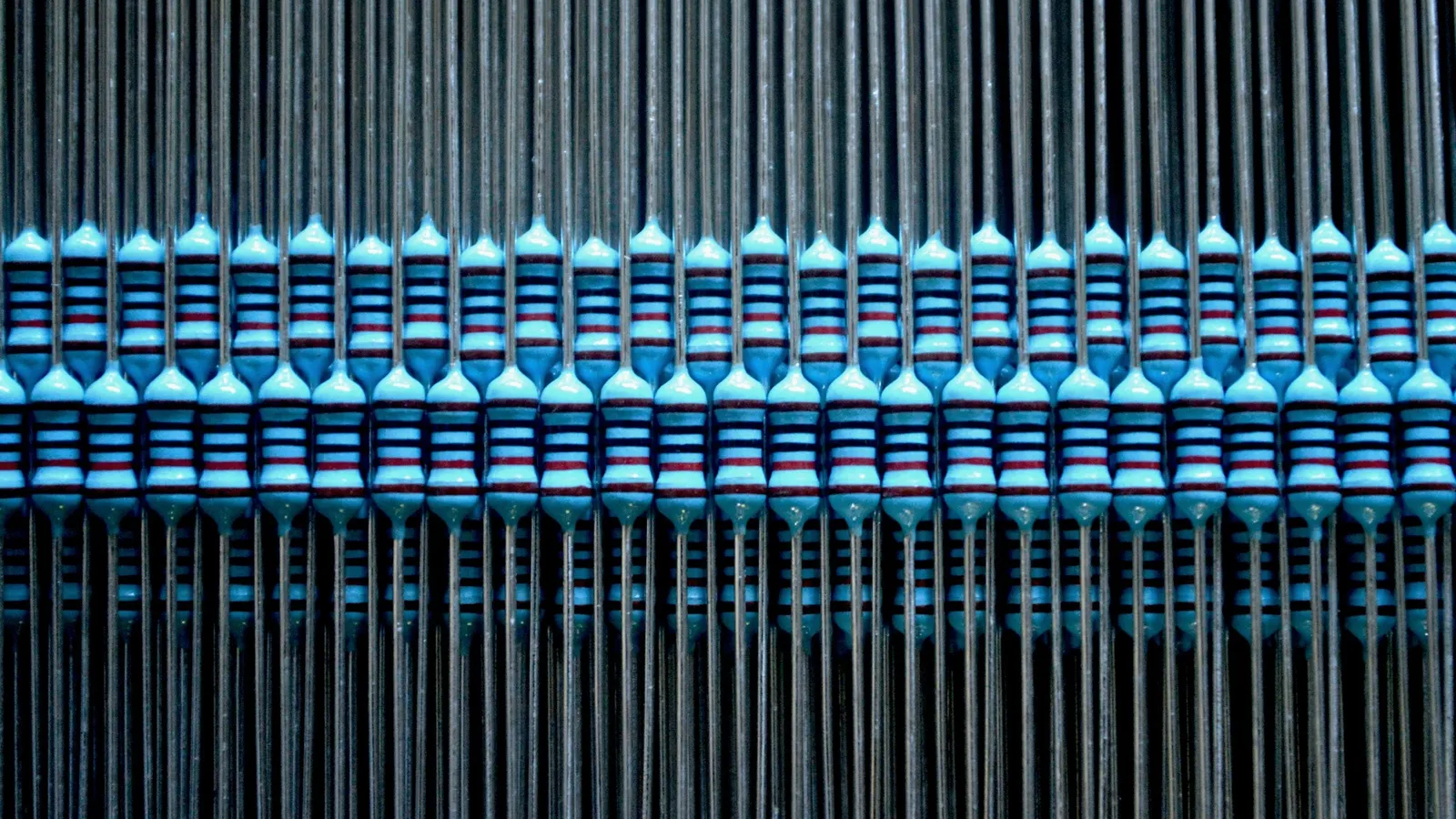 Rows of resistors lined up on tape
