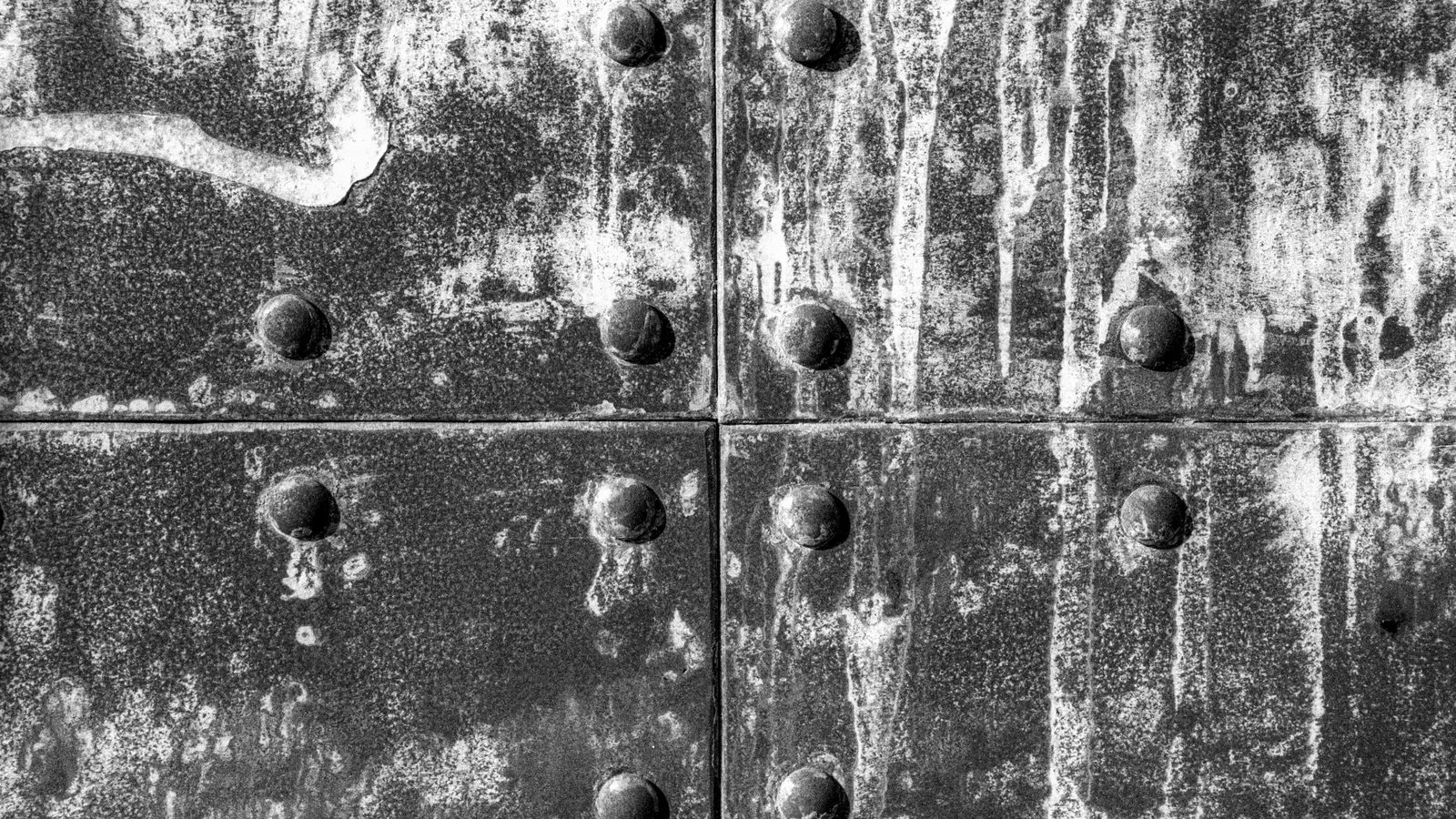 Rows of rivets on a weathered aircraft panel